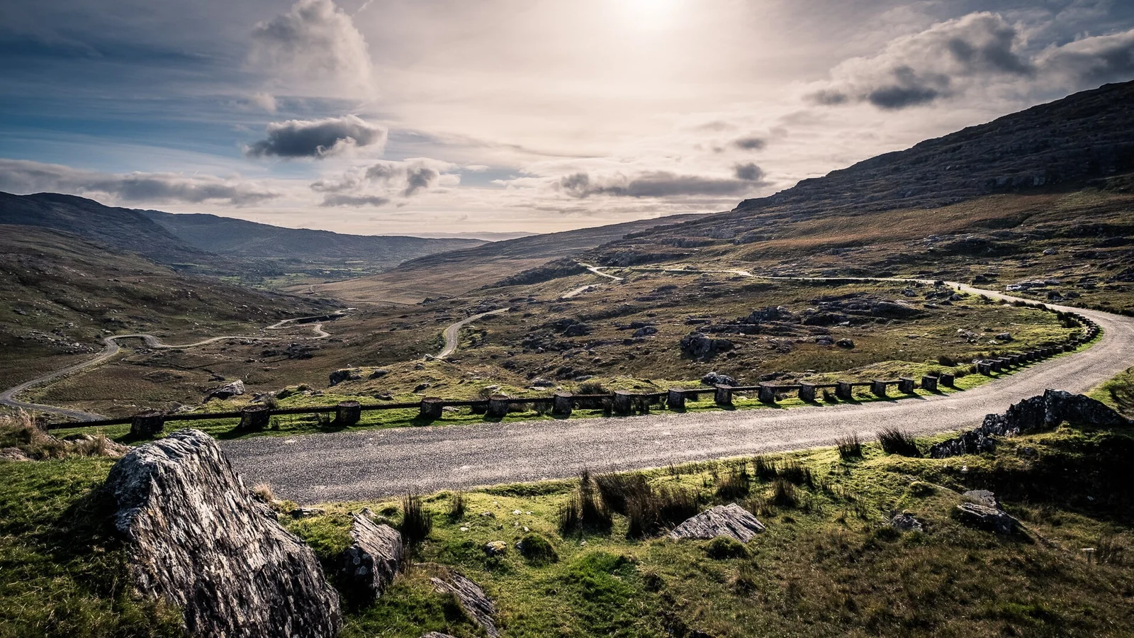 The winding Healy Pass road through a mountain valley